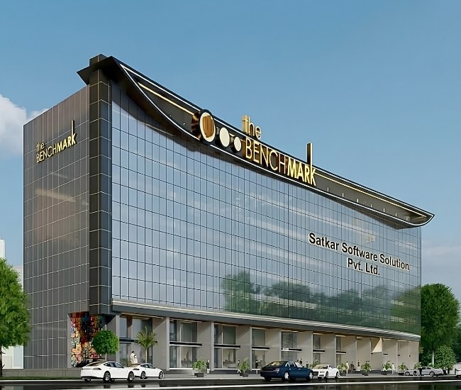 Satkar Software Solution Pvt. Ltd. signage on a modern glass office building